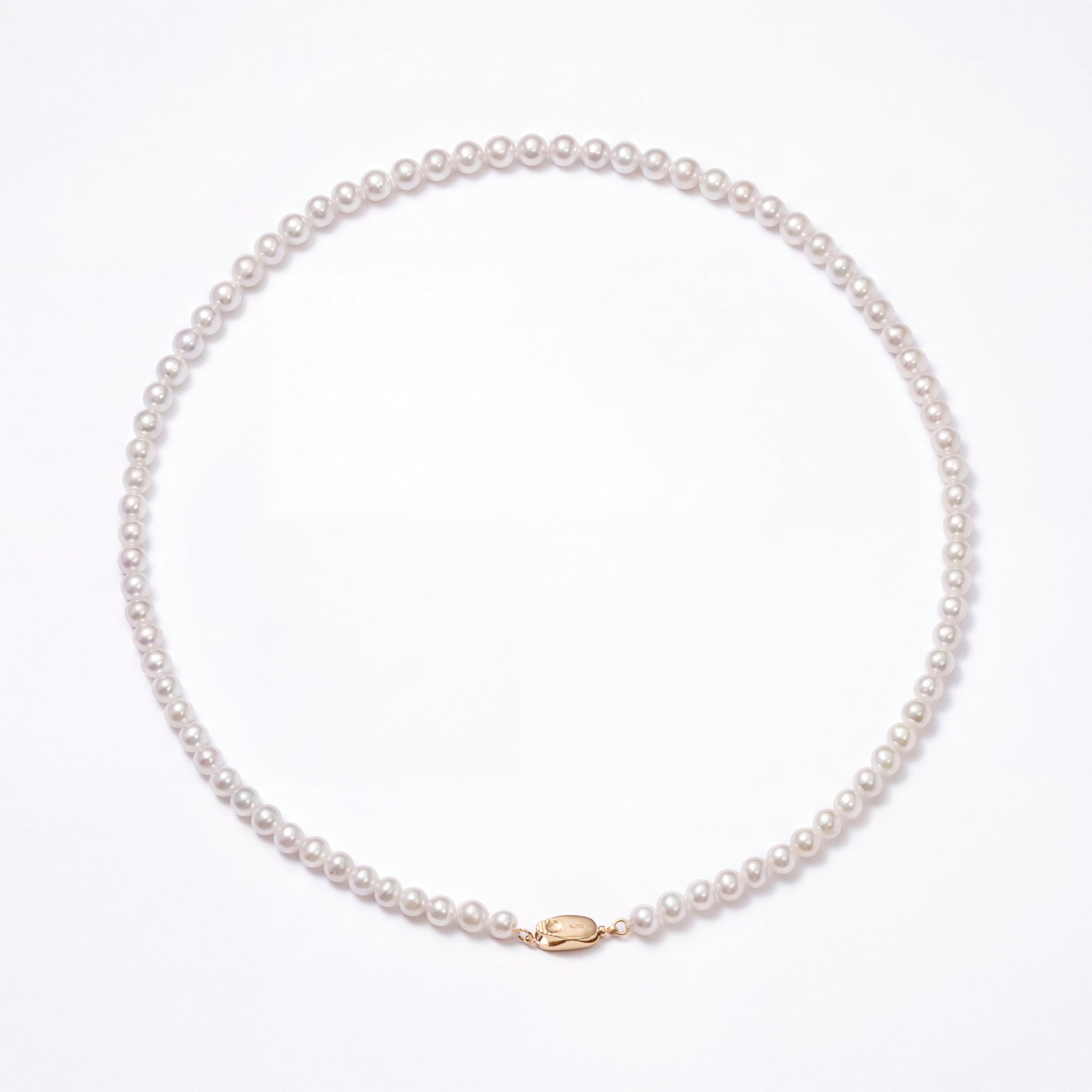 Pearl necklace with a gold clasp on a white background